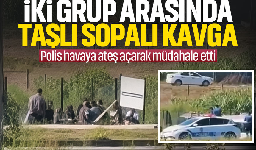 Taş ve sopalarla birbirlerine saldırdılar...Polis silahla havaya ateş açtı